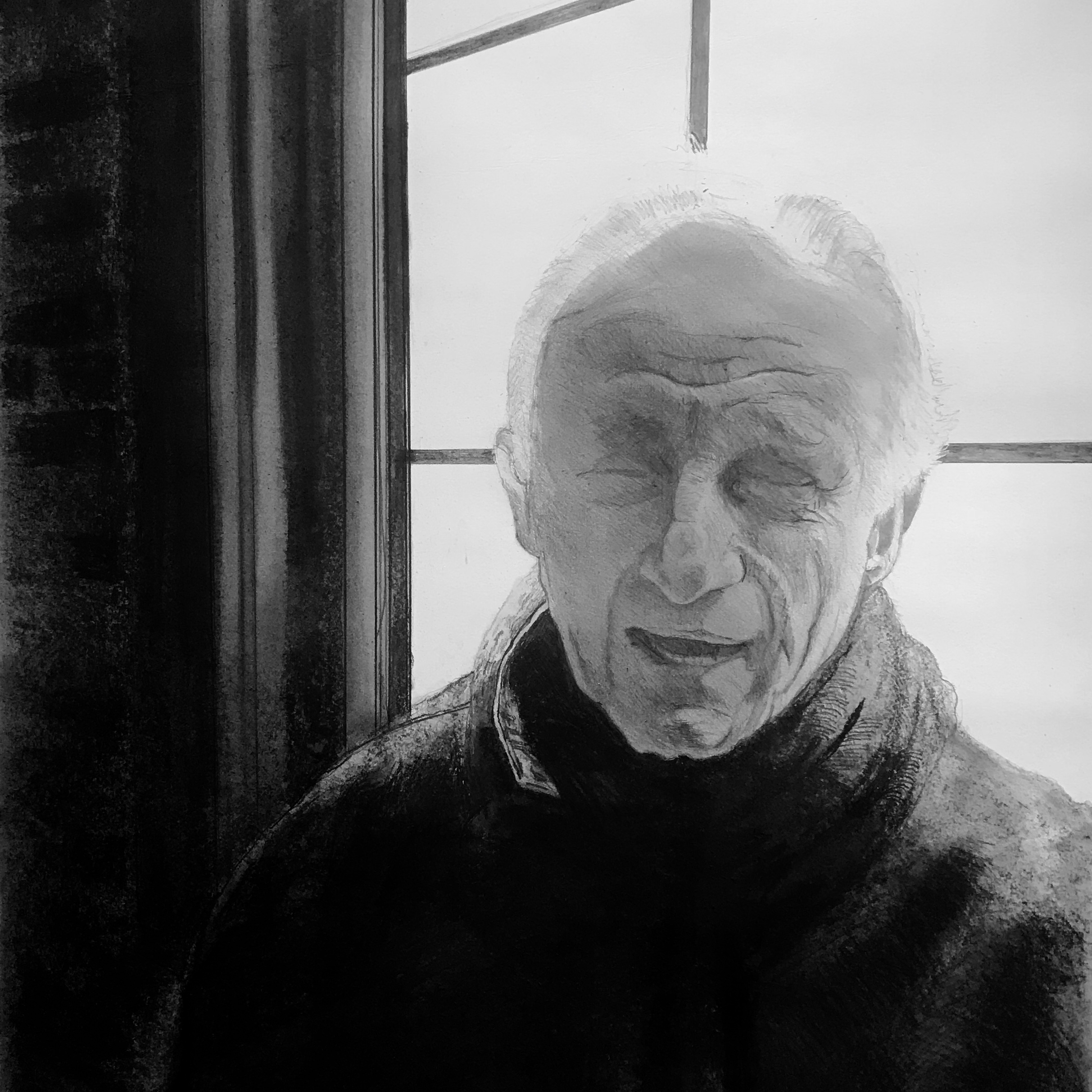 Man in front of a window